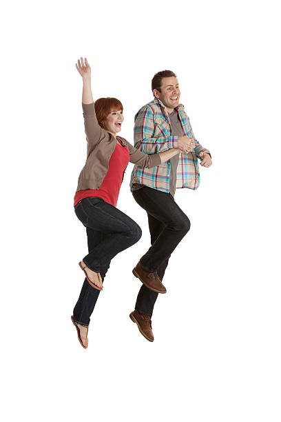 istock Excited young couple jumping 171290476
