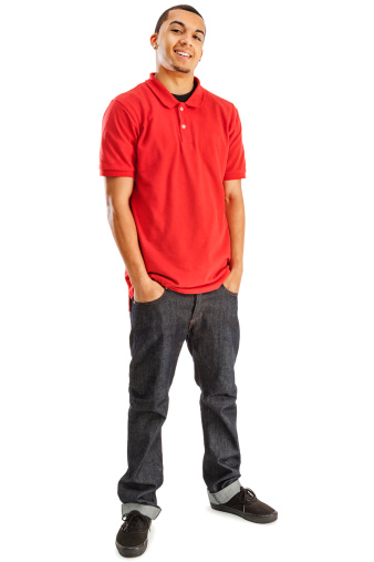 Photo of a young African Amercan male in red shirt and blue jeans; isolated on white.