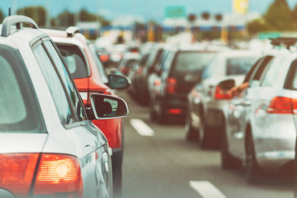 istock Large queue of vehicles on motorway pay toll in summer 1712910586