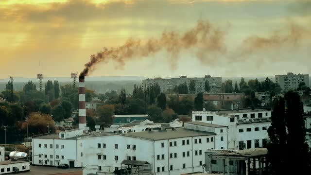 smoke comes from the factory chimney, polluting the environment