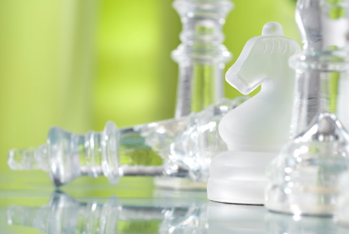 Selective-focus image of glass chess pieces