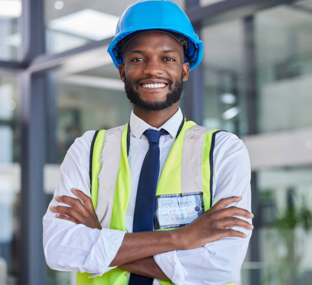 istock Portrait, construction and engineer man or construction worker with arms crossed in industrial startup office. Architecture, builder and industry with a male business owner in architect company 1712915530