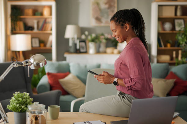 istock Businesswoman working from home office using smart phone 1712917799