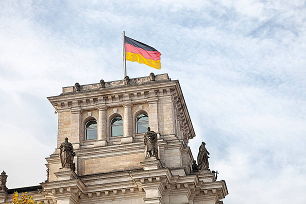 istock Berlin Reichstag detail and german flag 171292095