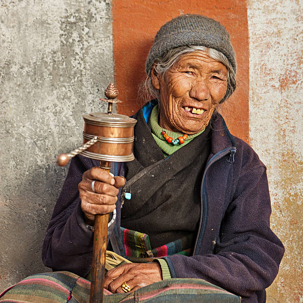 istock Tibetan woman praying, Mustang 171292099