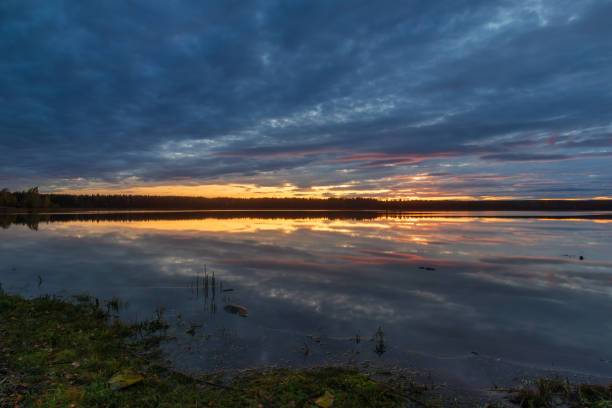 istock Dark golden sunset over the lake 1712921376