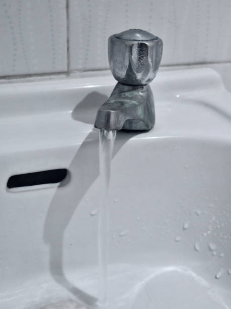 istock Water flowing from faucet. 1712924271