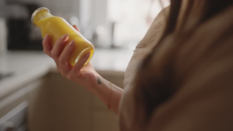 A nurse taking juice out of the fridge at home