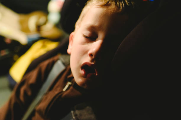 istock Child asleep in his extenuated car seat. 1712925347