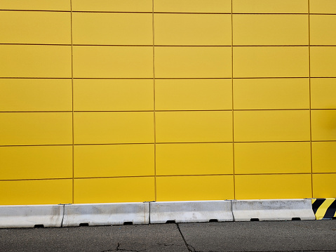 building cladding. facade metal sheets create a rectangle. easy-to-maintain surface painted in yellow. industrial buildings and warehouses for use on large solid walls, panelling
