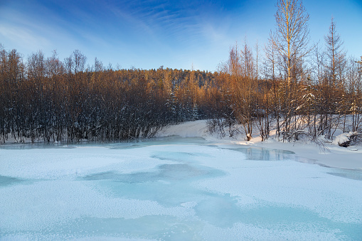 Frazil on a small river in South Yakutia, Russia. Evening winter landscape