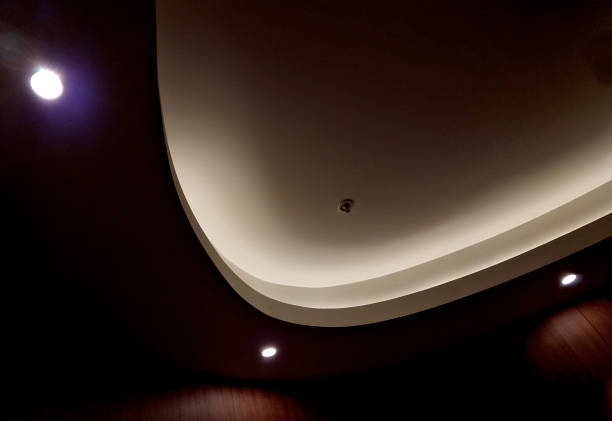 istock soffit with a cornice illuminated by LED strips in the arch. walls lined with brown wooden plywood. light cones make a festive impression. a night club with a great reputation and atmosphere, casino 1712927098