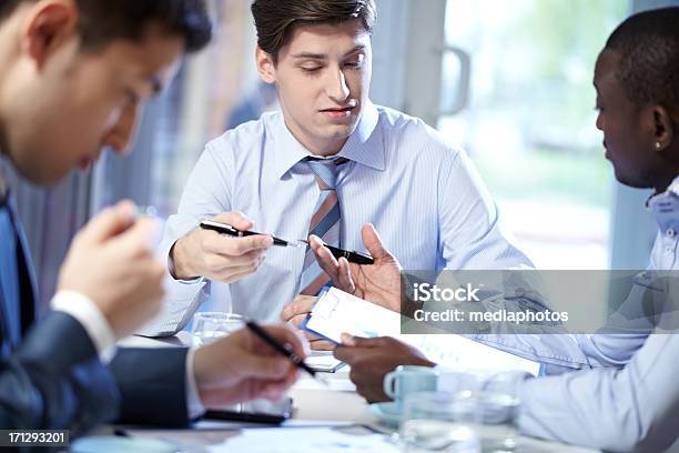 Discussion At Office Stock Photo - Download Image Now - 20-24 Years, Adult, Adults Only