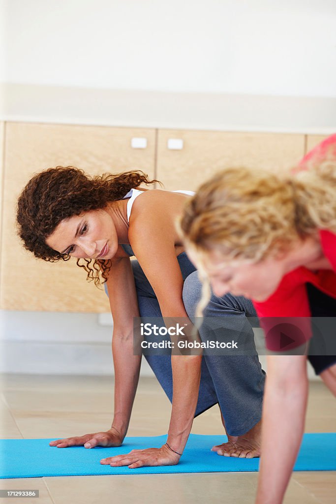 Making sure you are doing it right Gym class with members attempting poses Active Lifestyle Stock Photo