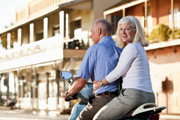 istock Senior couple riding motor scooter 171293397