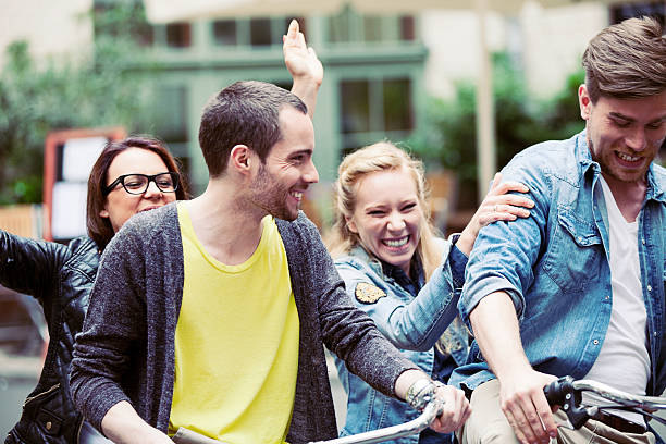 istock Two Teenage Couples Riding Bikes 171293640