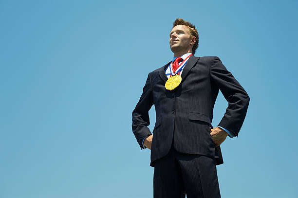 istock Proud Gold Medal Businessman Standing Outdoors with Hands on Hips 171293730