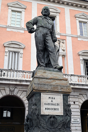 Pisa, Italy, september 18, 2023 : Bronze statue of Giuseppe Garibaldi created in 1892 by Ettore Ferrari in Garibaldi Square in the city of Pisa