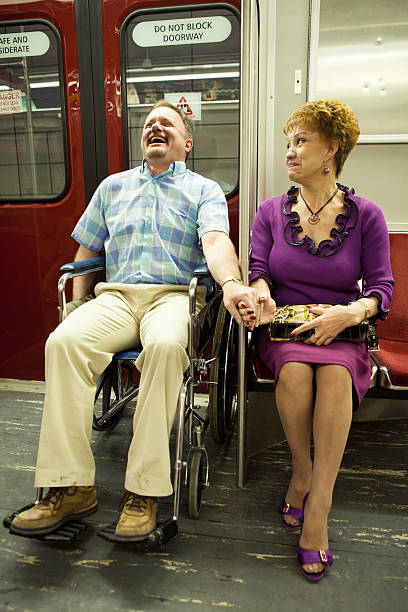 istock Couple laughing on a subway train 171294048