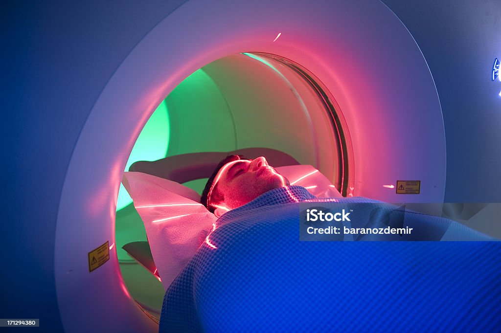 Man Receiving a Medical Scan "Man Receiving Scan,Tomography Tunnel-PET/CTTo see my other photos please click here:" CAT Scan Stock Photo