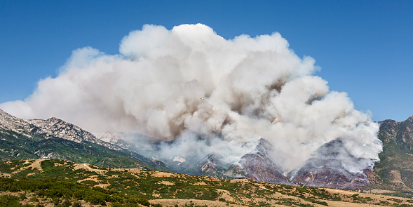 A fire burning in a mountain area.
