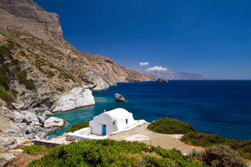 Idyllic coast of Amorgos, in the Cyclades Islands of Greece, with a small chapel guarding the coast.