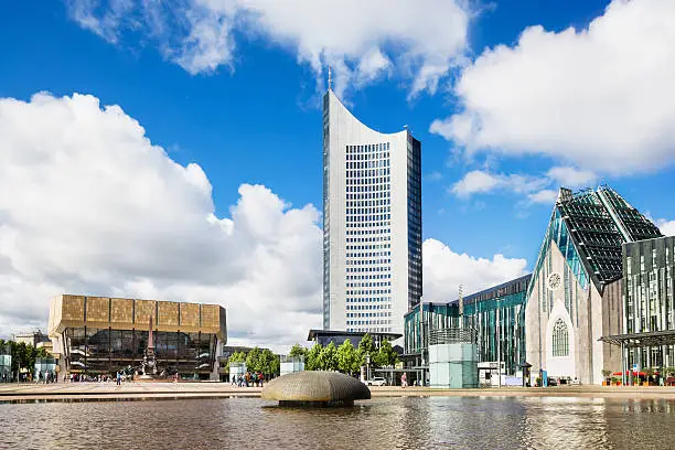 Gewandhaus concert hall with Mende fountain and the new university campus at Augustusplatz in Leipzig, Germany