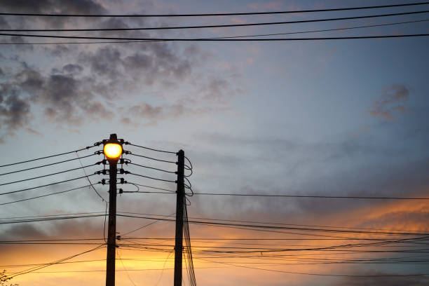 istock street lamp hanging on electricity pole with many cables. 1712972925