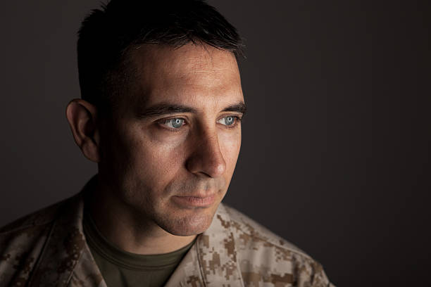 Marine Deep in Thought A United States Marine deep in thought. Is he concerned about his future or his pastThis image is only available here on iStock. post traumatic stress disorder photos stock pictures, royalty-free photos & images