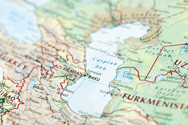 Caspian Sea "Photo map of Caspian Sea. Shallow depth of field, focus on the Baku city, Azerbaijan of the map and the area nears it." caucasus stock pictures, royalty-free photos & images