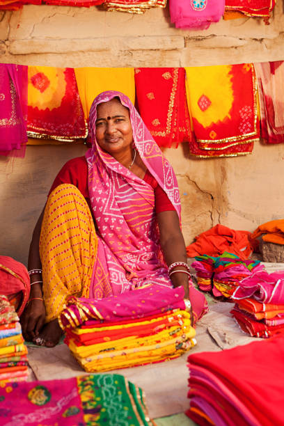 istock Woman selling colorful fabrics 171297977