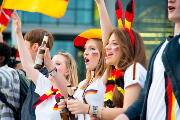 German Soccer Fans Celebrating "Berlin, Germany - June 13, 2012: Group of german soccer fans at the public viewing in berlin watching the football match.Cheering,  celebrating, having fun together." european football championship stock pictures, royalty-free photos & images