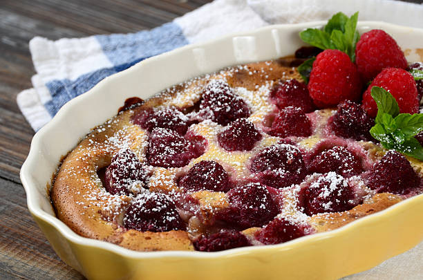 Raspberry Clafoutis "A twist on the traditional French dessert, a clafoutis made with seasonal fresh raspberries.More images from this series:" clafoutis stock pictures, royalty-free photos & images