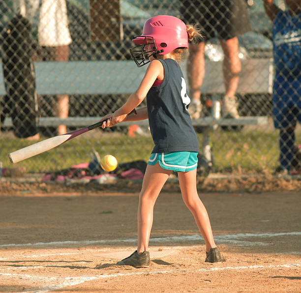 istock Young Girl Softball Player Batting in Competitive Game 171298667