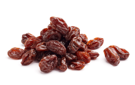 heap of raisins isolated on white background