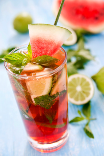 Fresh mojito with watermelon on a wooden table