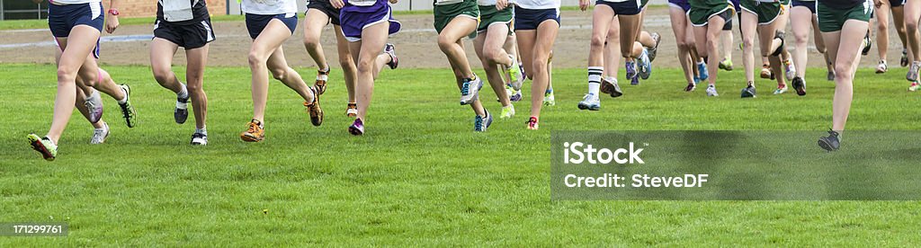 Group of runners starting a Cross country race Cross-Country Running Stock Photo