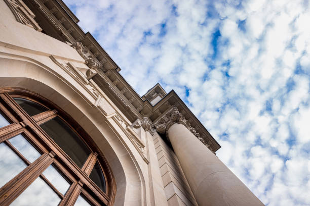 istock Large historic building with large columns, seen at a low angle, with a sky in the background, called Correos in Valencia, Spain. 1712999344