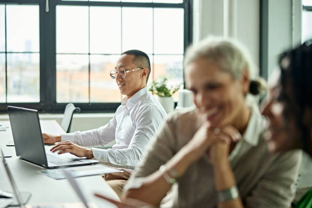 istock Business colleagues at flexible workstation 1713001049