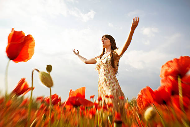 istock Young woman with spread arms looking up 171300279
