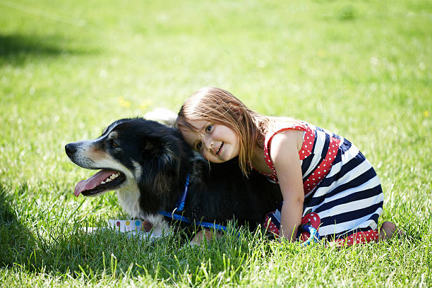 istock Four year old girl with border collie 171300394