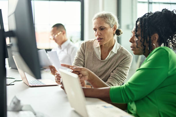 istock Mature businesswomen collaborating on project 1713006186