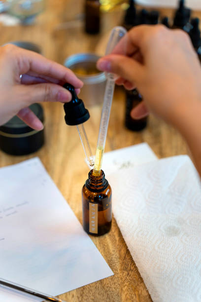 istock Aromatic candle workshop. Measuring the amount of essence needed. 1713008344