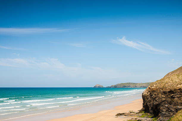 bright June day at Perrnoporth beach, near Newquay in Cornwall.
