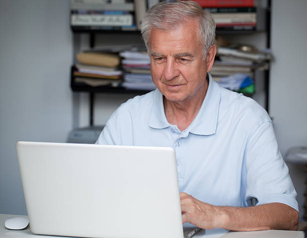 istock Senior man sitting at laptop 171300897