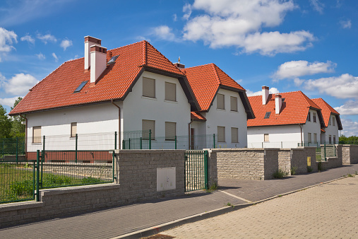 Semi-detached houses against blue sky