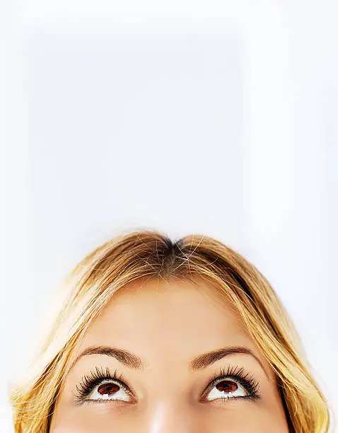 Photo of Close-up of a young woman looking up