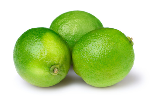 Three limes on white background