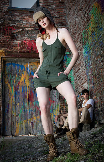 istock Young Woman Standing Outside Graffiti Covered Building 171301291
