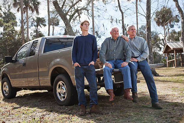 Three generation family with pickup truck